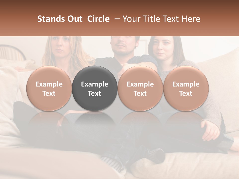 A Man And Woman Sitting On A Couch Pointing At Something PowerPoint Template