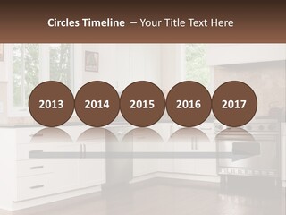 A Kitchen With White Cabinets And A Stainless Steel Stove PowerPoint Template