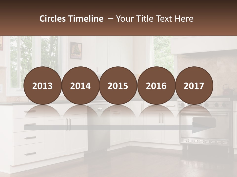 A Kitchen With White Cabinets And A Stainless Steel Stove PowerPoint Template