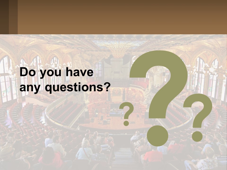 A Large Auditorium Filled With Lots Of People PowerPoint Template