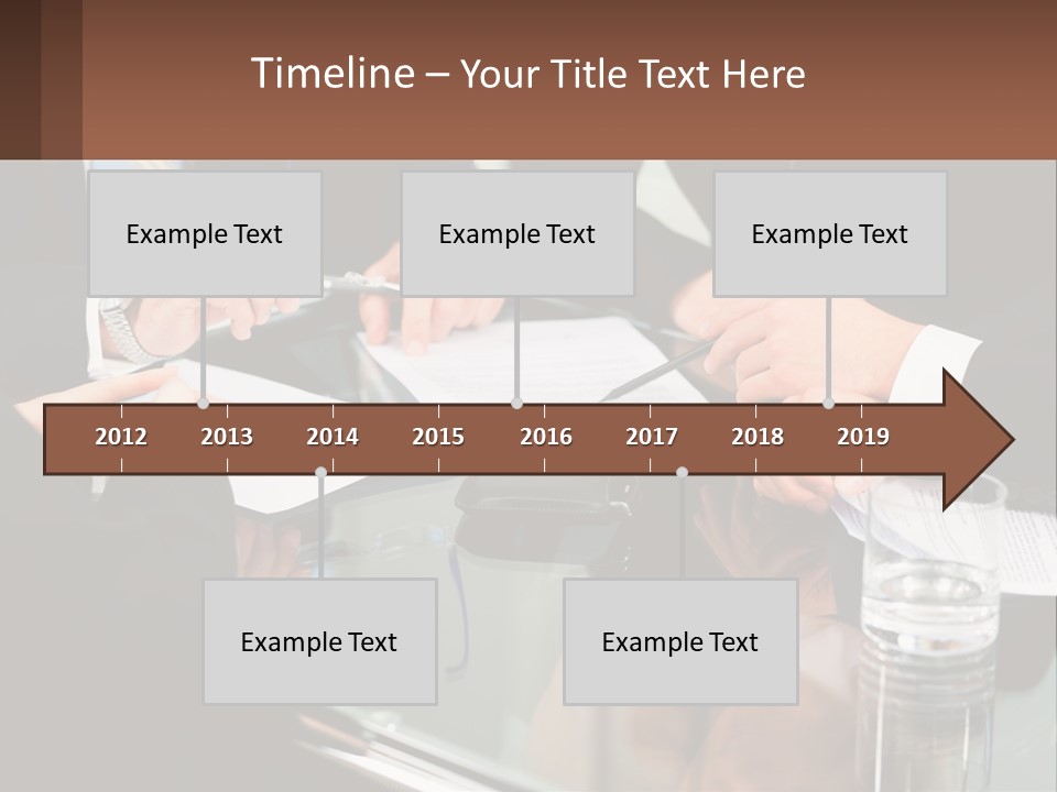 A Group Of Business People Sitting Around A Table PowerPoint Template