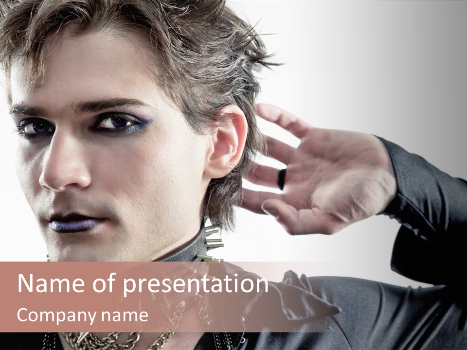 A Man With A Necklace On His Neck Is Holding His Hand Up To His Ear PowerPoint Template