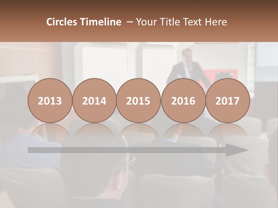 A Man Giving A Presentation To A Group Of People PowerPoint Template