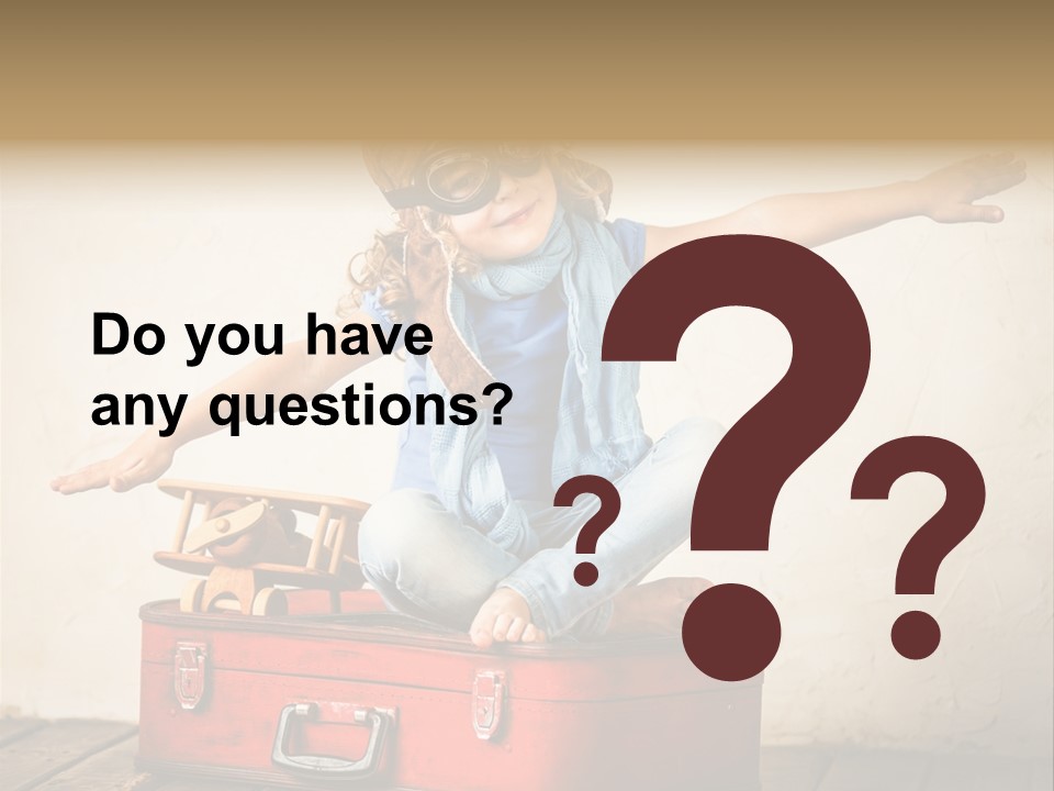 A Little Girl Sitting On Top Of A Suitcase PowerPoint Template