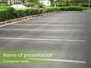 An Empty Parking Lot With A Car Parked In It PowerPoint Template