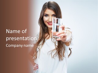 A Woman Holding A Glass Of Water In Her Hand PowerPoint Template