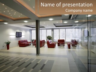 A Large Room With Red Chairs And A Television On The Wall PowerPoint Template