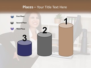 A Woman Sitting At A Desk In Front Of A Computer PowerPoint Template