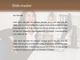 A Woman Sitting At A Desk In Front Of A Computer PowerPoint Template