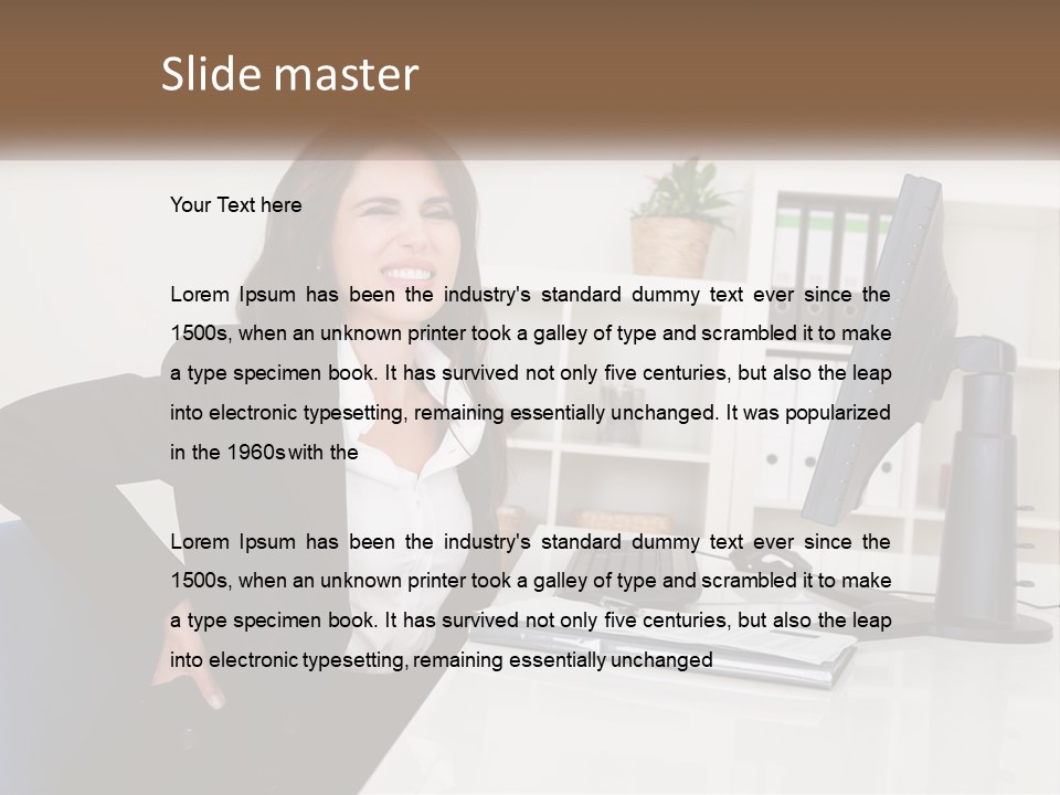 A Woman Sitting At A Desk In Front Of A Computer PowerPoint Template