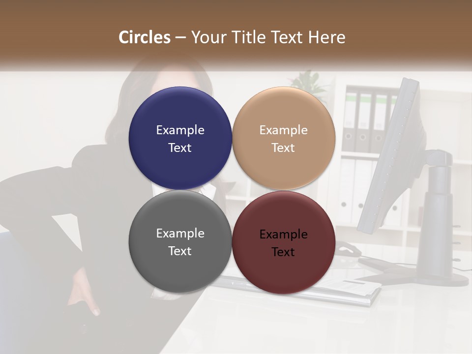 A Woman Sitting At A Desk In Front Of A Computer PowerPoint Template