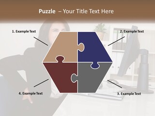 A Woman Sitting At A Desk In Front Of A Computer PowerPoint Template