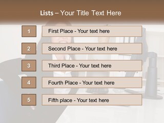 A Woman Sitting At A Desk In Front Of A Computer PowerPoint Template