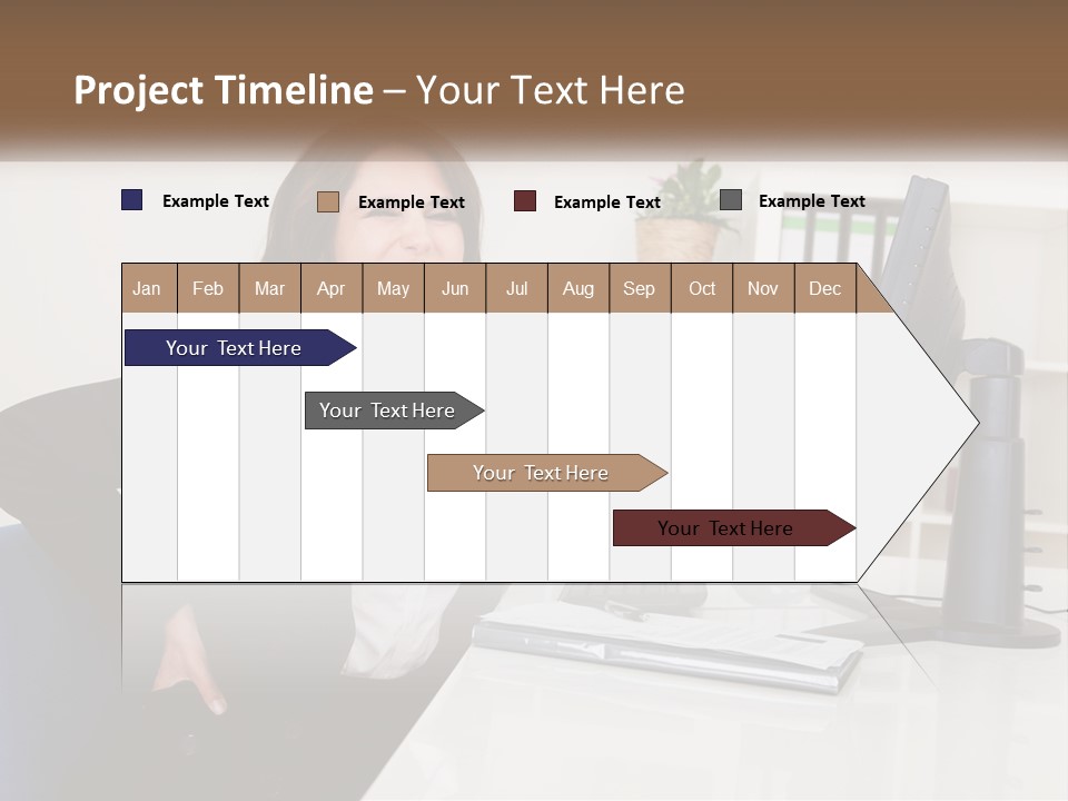 A Woman Sitting At A Desk In Front Of A Computer PowerPoint Template