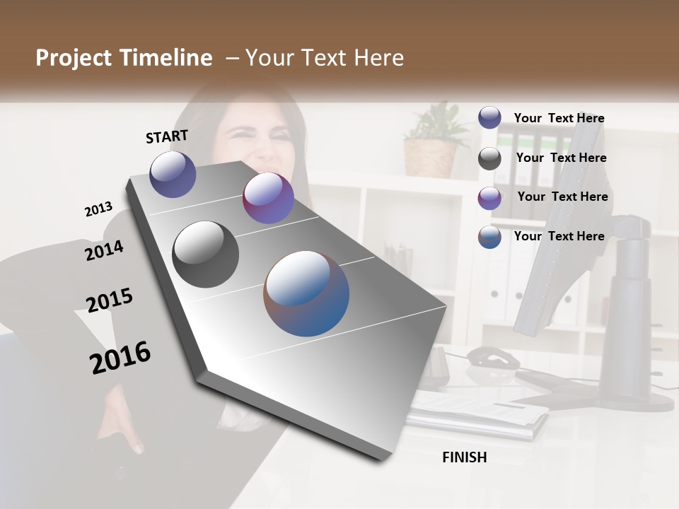 A Woman Sitting At A Desk In Front Of A Computer PowerPoint Template
