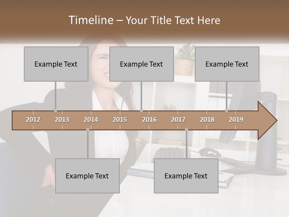 A Woman Sitting At A Desk In Front Of A Computer PowerPoint Template