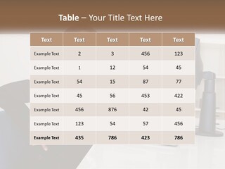 A Woman Sitting At A Desk In Front Of A Computer PowerPoint Template