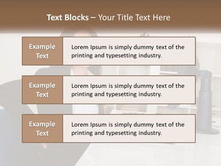 A Woman Sitting At A Desk In Front Of A Computer PowerPoint Template