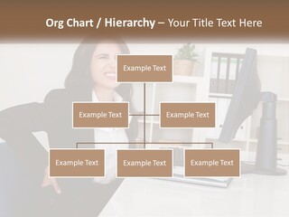 A Woman Sitting At A Desk In Front Of A Computer PowerPoint Template