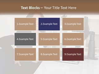 A Woman Sitting At A Desk In Front Of A Computer PowerPoint Template