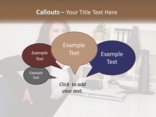 A Woman Sitting At A Desk In Front Of A Computer PowerPoint Template