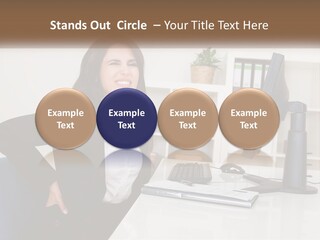 A Woman Sitting At A Desk In Front Of A Computer PowerPoint Template