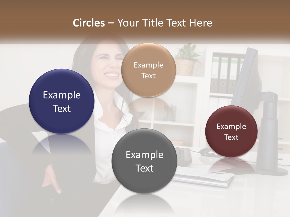 A Woman Sitting At A Desk In Front Of A Computer PowerPoint Template