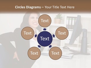 A Woman Sitting At A Desk In Front Of A Computer PowerPoint Template