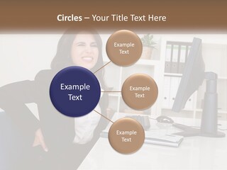 A Woman Sitting At A Desk In Front Of A Computer PowerPoint Template