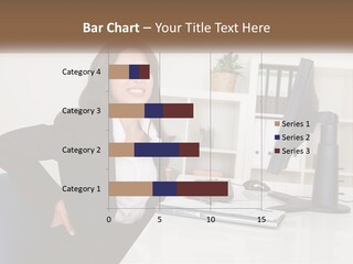 A Woman Sitting At A Desk In Front Of A Computer PowerPoint Template