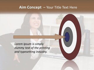 A Woman Sitting At A Desk In Front Of A Computer PowerPoint Template