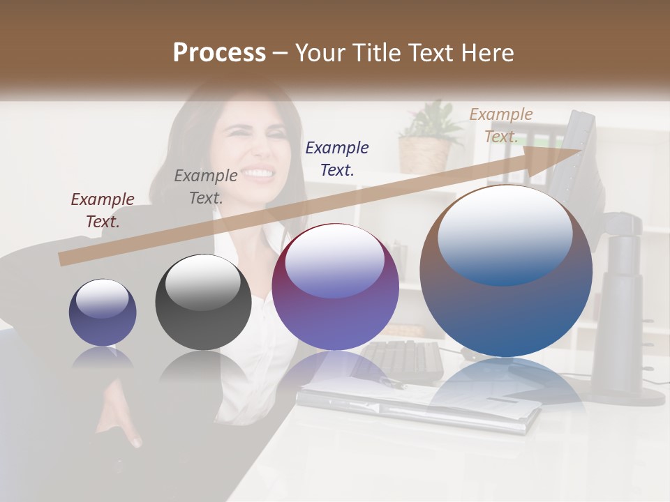 A Woman Sitting At A Desk In Front Of A Computer PowerPoint Template