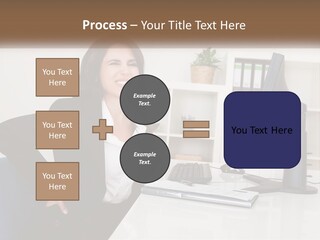 A Woman Sitting At A Desk In Front Of A Computer PowerPoint Template