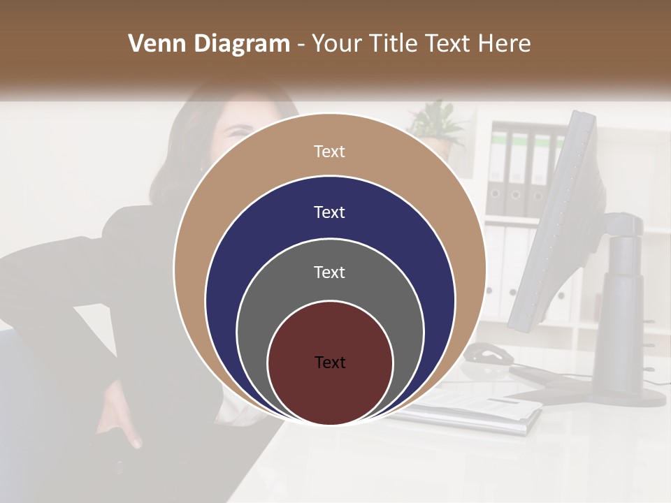 A Woman Sitting At A Desk In Front Of A Computer PowerPoint Template