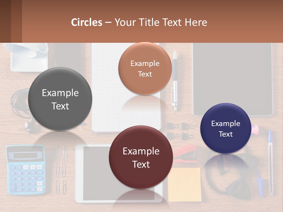 A Wooden Table Topped With Lots Of Office Supplies PowerPoint Template
