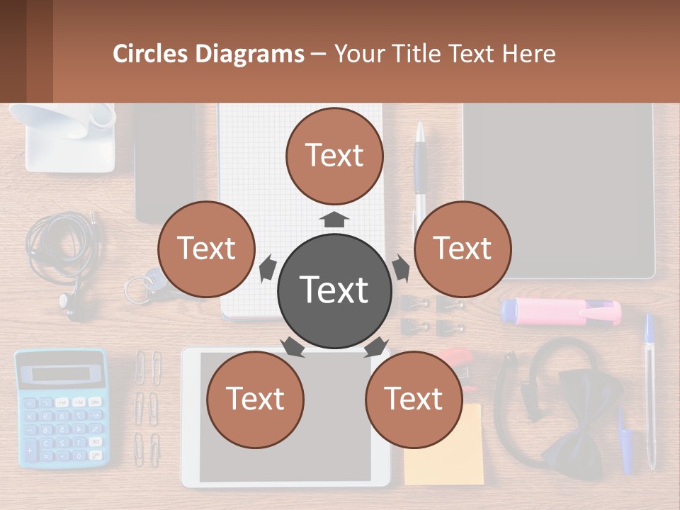 A Wooden Table Topped With Lots Of Office Supplies PowerPoint Template