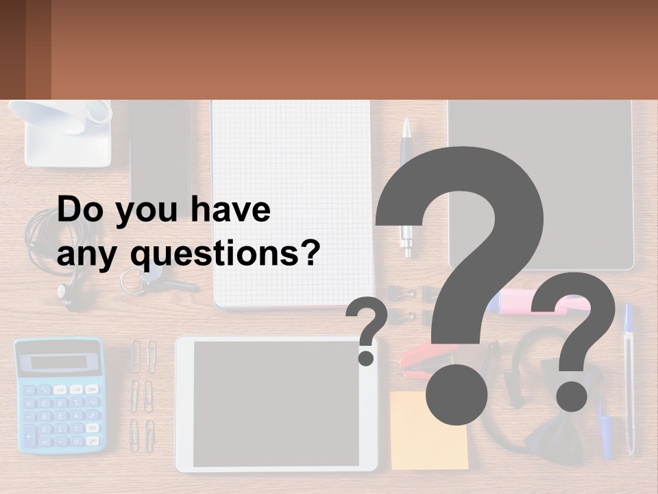 A Wooden Table Topped With Lots Of Office Supplies PowerPoint Template