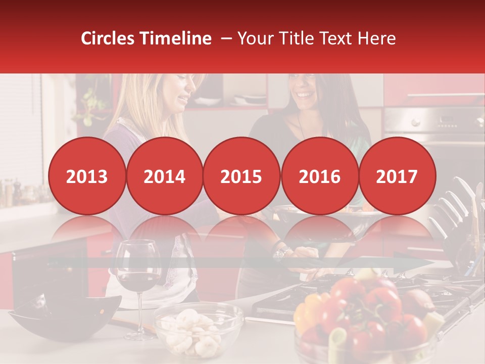 Two Women Standing In A Kitchen Preparing Food PowerPoint Template