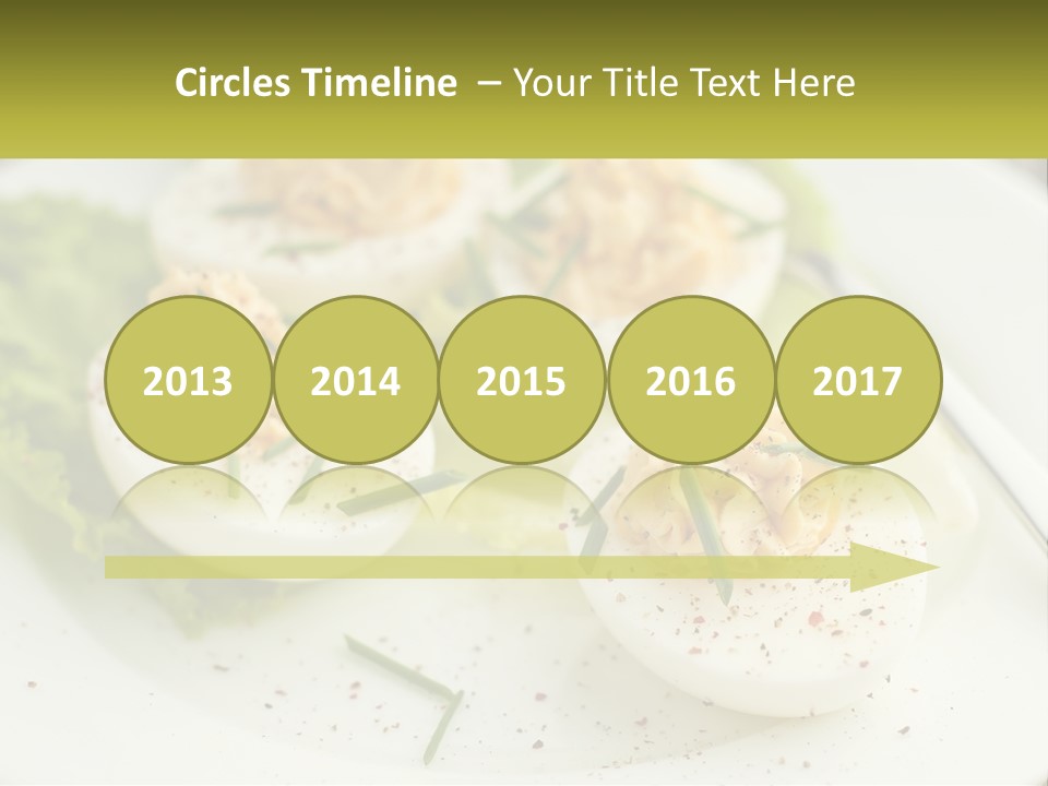 A White Plate Topped With Deviled Eggs Covered In Cheese PowerPoint Template