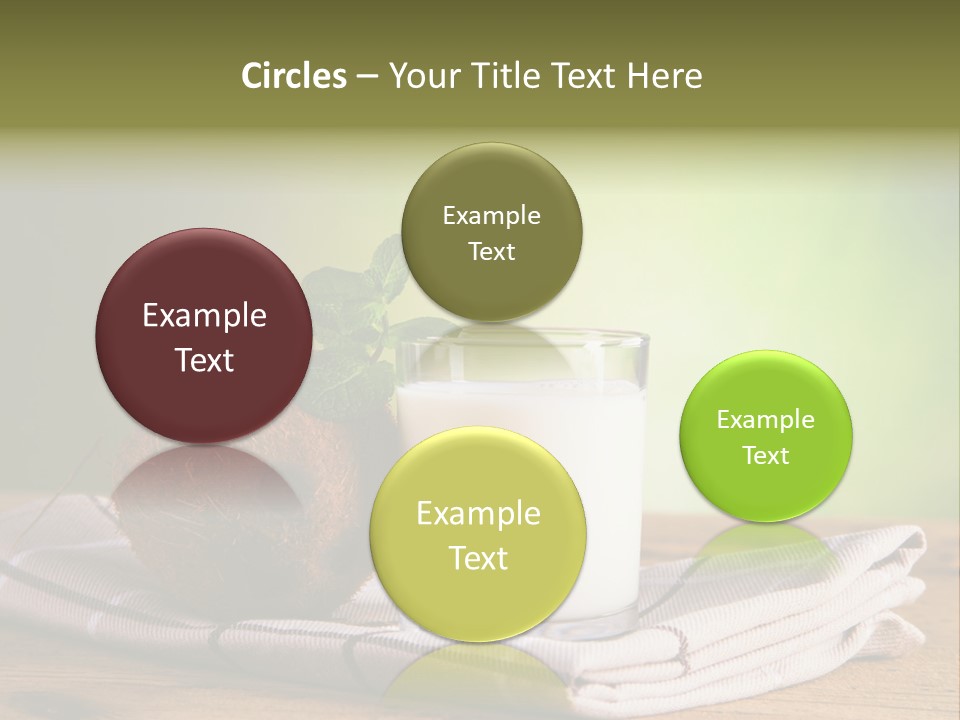 A Glass Of Milk Next To A Coconut On A Table PowerPoint Template