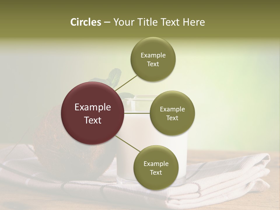 A Glass Of Milk Next To A Coconut On A Table PowerPoint Template