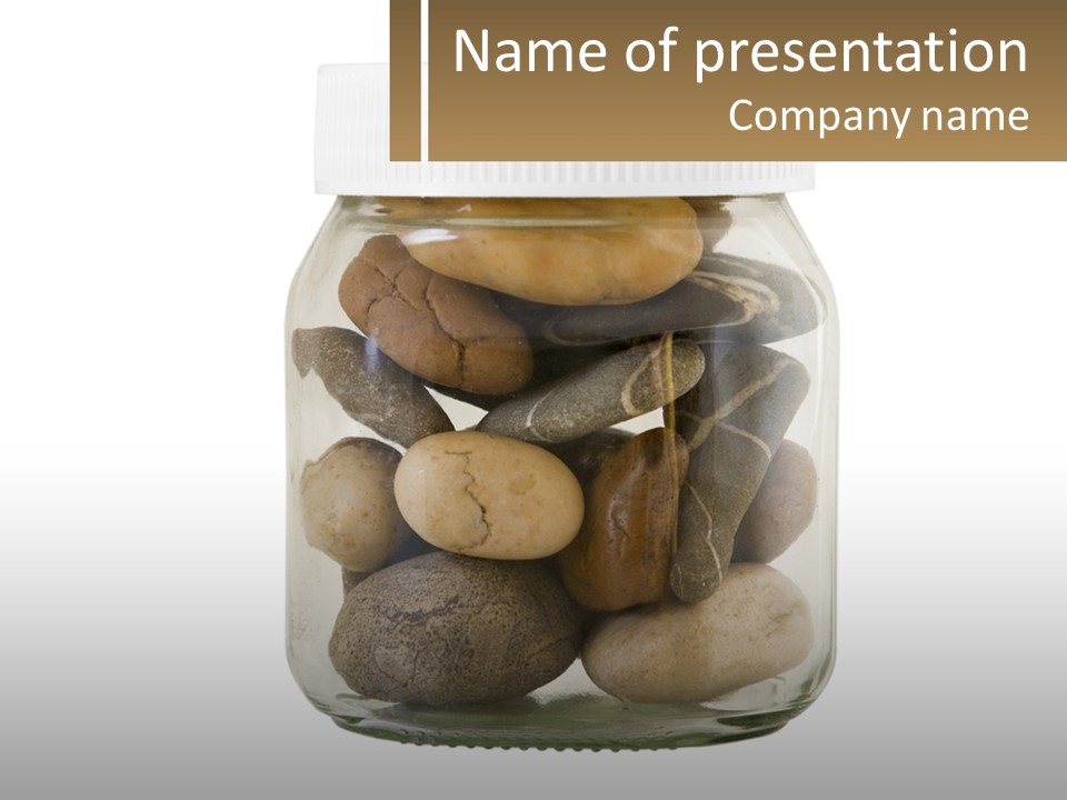 A Jar Filled With Lots Of Rocks On Top Of A Table PowerPoint Template