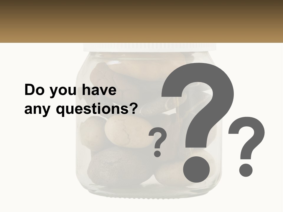 A Jar Filled With Lots Of Rocks On Top Of A Table PowerPoint Template