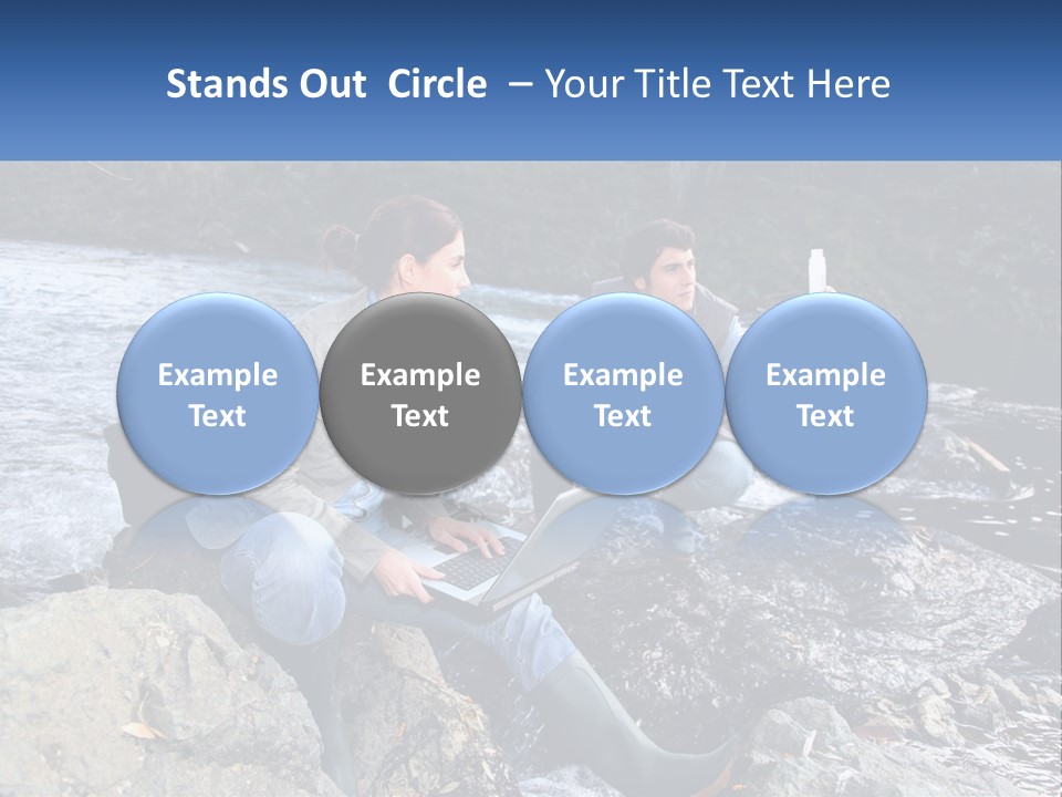 A Man And A Woman Sitting On Rocks With A Laptop PowerPoint Template