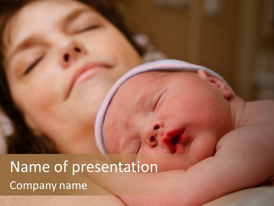 A Woman Holding A Sleeping Baby In Her Arms PowerPoint Template