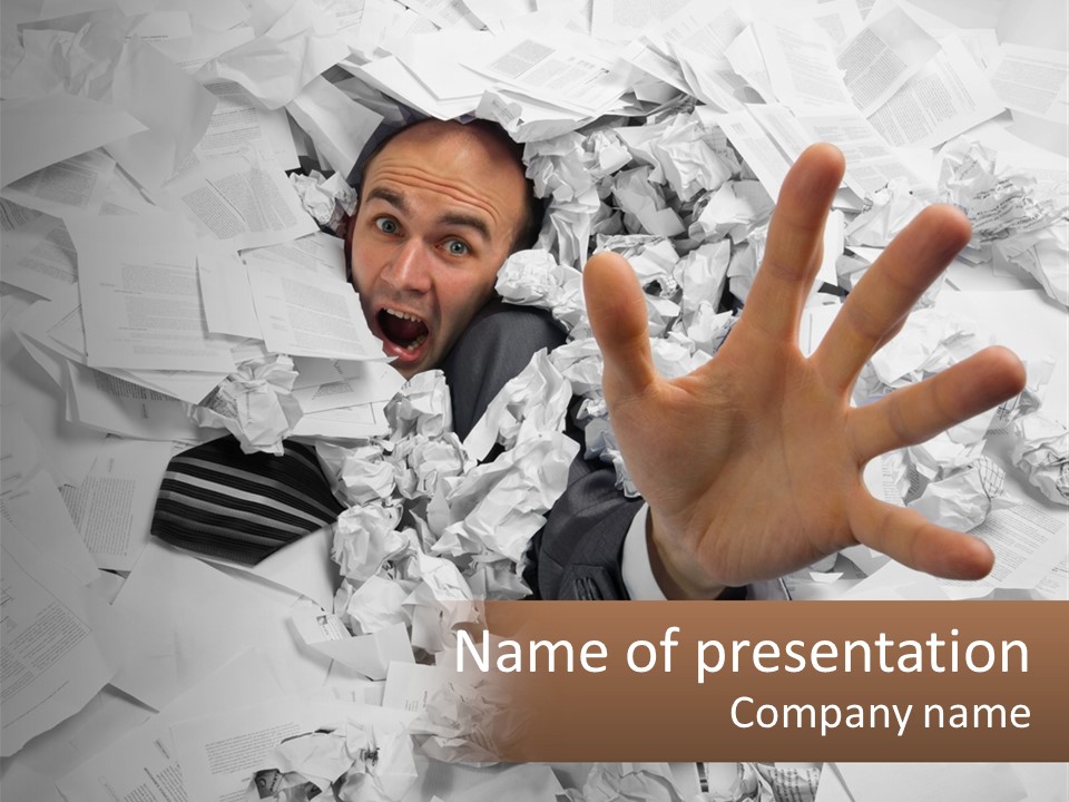 A Man With His Hand Out Through A Pile Of Papers PowerPoint Template