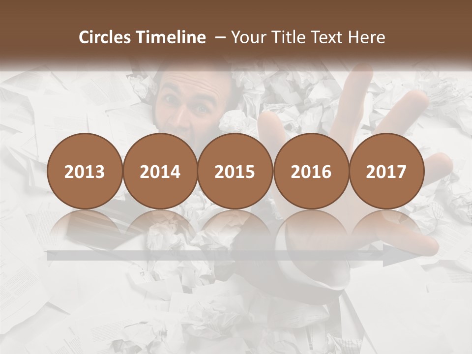 A Man With His Hand Out Through A Pile Of Papers PowerPoint Template