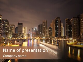 A City Skyline At Night With A River In The Foreground PowerPoint Template