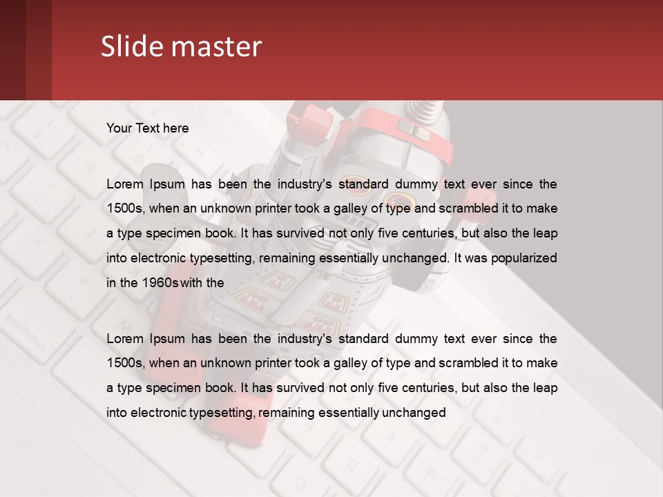 A Robot Keychain Sitting On Top Of A Keyboard PowerPoint Template