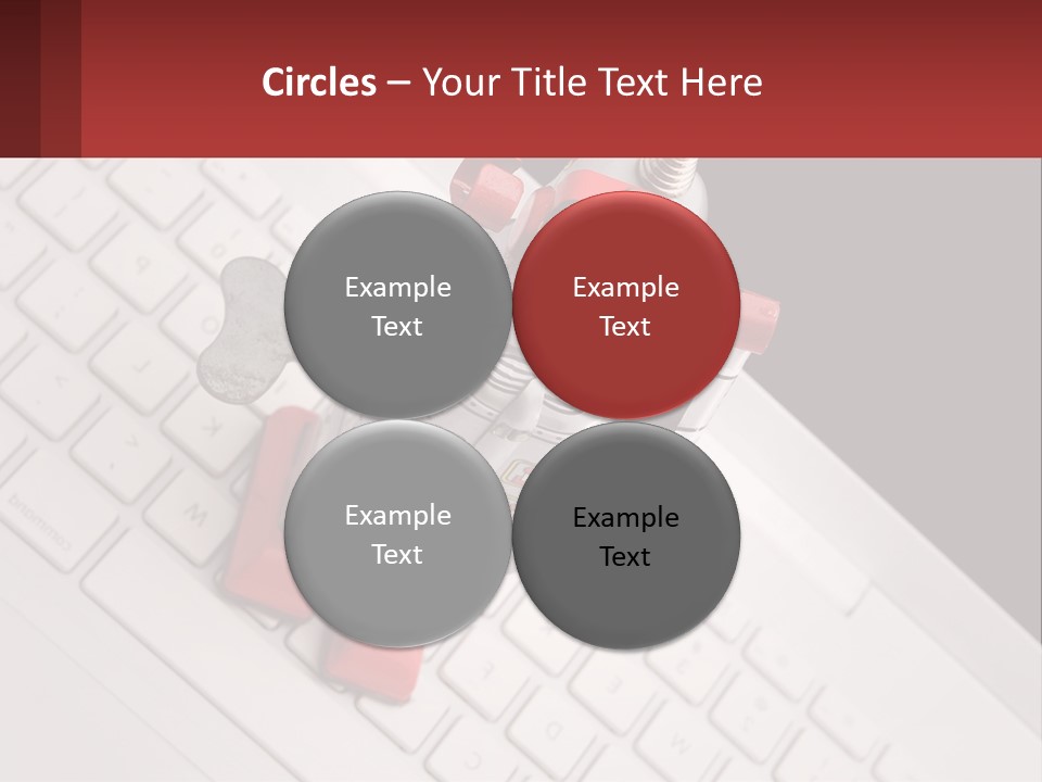 A Robot Keychain Sitting On Top Of A Keyboard PowerPoint Template